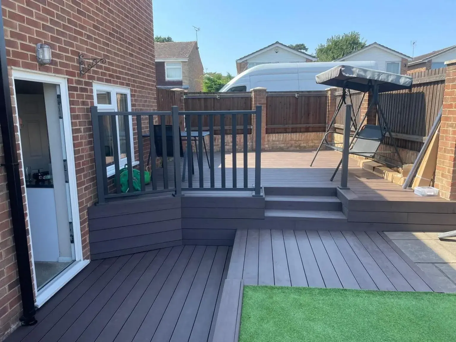 Composite decking with railing and raised seating