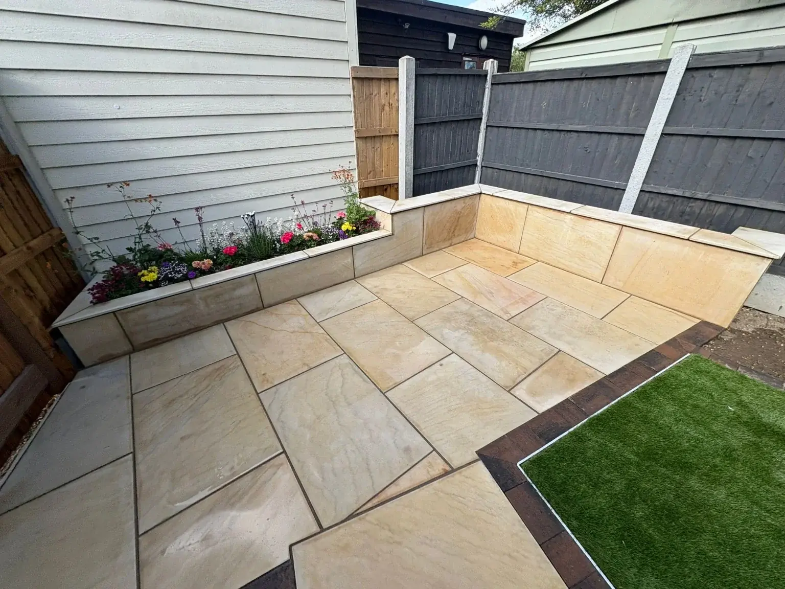 Sandstone patio with a raised border